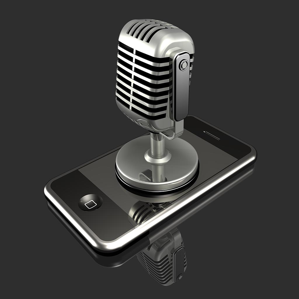 A large silver microphone sitting on top of an iPhone 3Gs